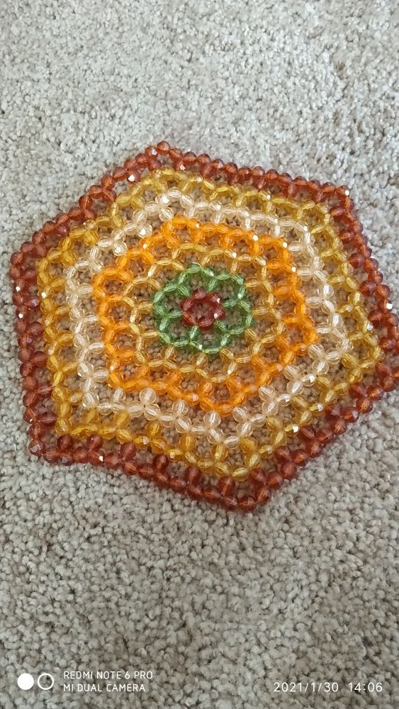 Small decorative beaded placemate