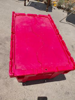 Long red storage bin with folding lid