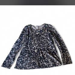 Woman’s Black And White Blouse