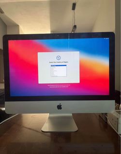 iMac with mouse and keyboard