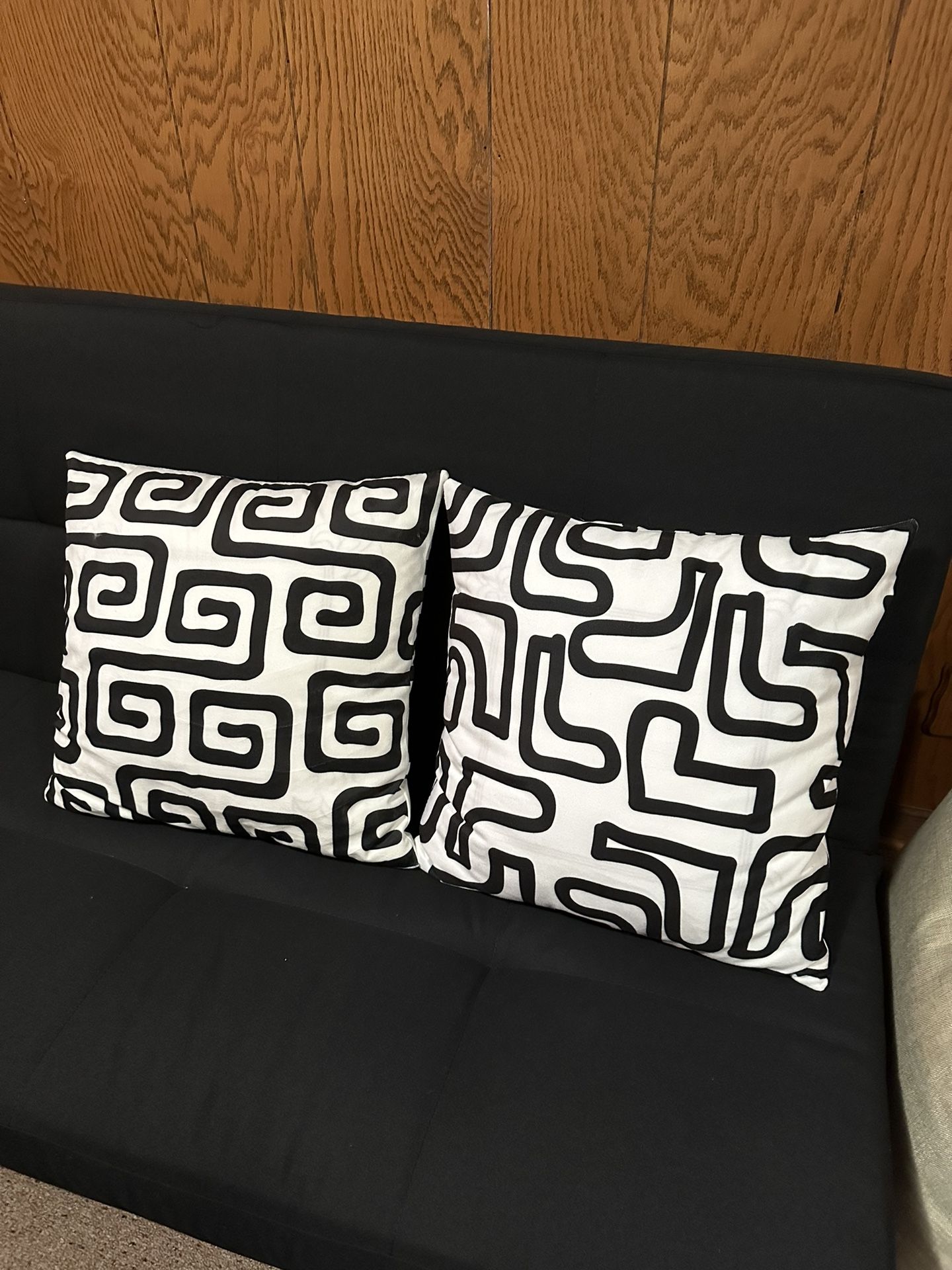 A Set Of 15x15 Black And White Print Pillow Covers