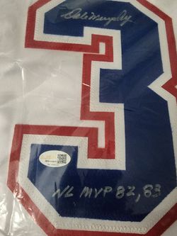 Dale Murphy signed Atlanta Braves jersey inscriptions for his 1982 and 1983 NL MVP. has a JSA authentication.