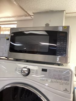 New Ge microwaves stainless steel & white