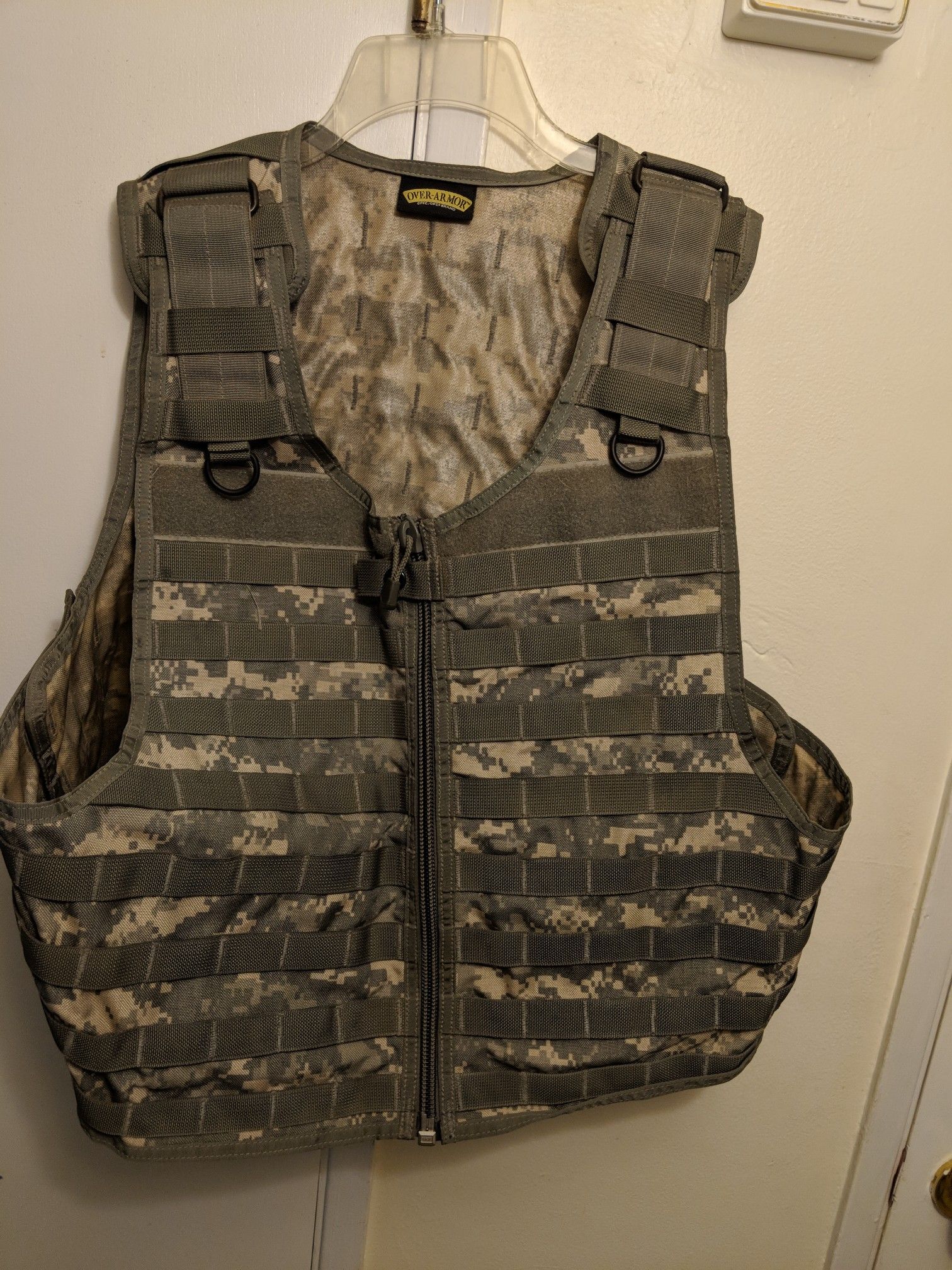 Spec Ops brand, over armor tactical vest. Molle strap attachment front, back, and sides. Fully adjustable.