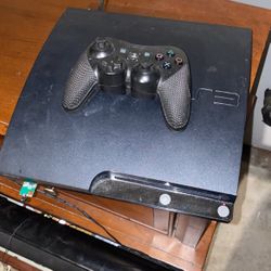 PS3 With Remote And Games 