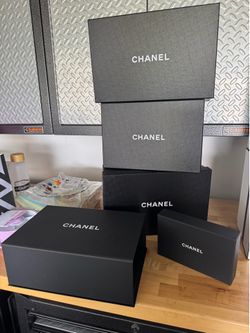 5 black Chanel boxes all