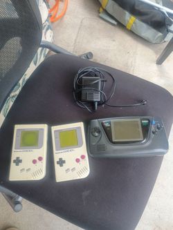 2 game boy and 1 Sega game gear handheld consoles