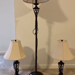 Three dark brown antique metal lamps a great conversation piece will accept best offer