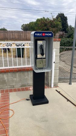Pay phone with shroud/light/stand