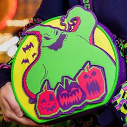 Disney Parks Loungefly Oogie Boogie Bash convertible crossbody bag featuring a green monster appliqué.