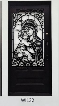Puerta de metal con diseño de la vigíen y el niño Jesús