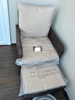 Patio lounge chair with hidden ottoman