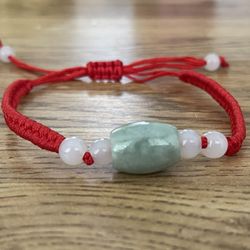 Natural Charged Money Jade Rolling Ball With Lucky RED  String Bracelet (known For: Protection, Calm Emotions, Wisdom , Release Negatively)