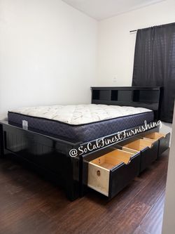 Black full bed and mattress with drawers