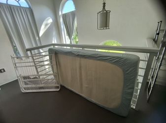 Twin 10" memory foam mattress with white, metal folding bed frame