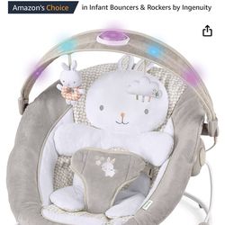 Ingenuity InLighten Baby Bouncer Infant Seat with Light Up -Toy Bar, Vibrations, Tummy Time Pillow & Sounds, 0-6 Months Up to 20 lbs (Twinkle Tails Bu