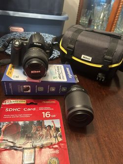 Nikon 5000 35mm Camera ,case , Extra Lense Charger And Sundisk