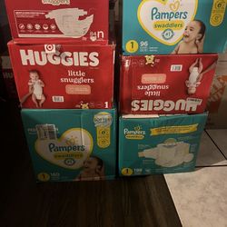 BRAND NEW BOXES OF DIAPERS 