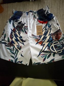 Medium Corruptive Creative white shorts with blue, red, and green bird and leaf graphic #birdprint