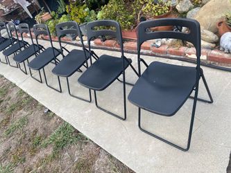 Folding plastic chairs