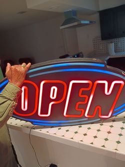 Big open sign on of beautiful preowned