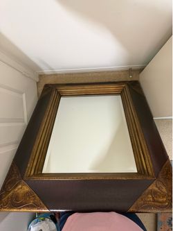 Mirror with leather board