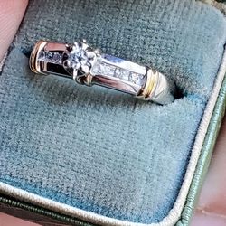 14k gold ring with quarter carat of diamonds
