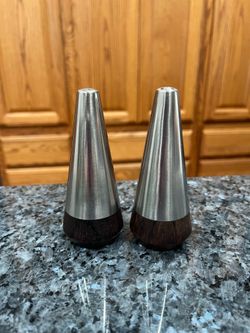Vintage MCM A&B Rosewood and Aluminum Pair of Salt and Pepper Shakers.  Size approximately 4 1/4 inches tall.  Preowned.  Has been on display in a cab