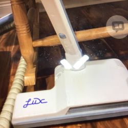 Electrolux, vacuum cleaner, light gray in color