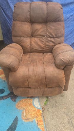 Brown suade RECLAIRNER CHAIR .40 in .tall 36 wide.