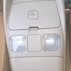 Brand new in box. Dodge ram. Center roof lights and storage compartment.