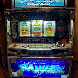 Machine Like Packman, But It's A Tokin Machine. SeaMaster.  It.lights Up When You Get Certain Pictures In A Row