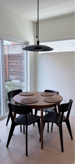 Round Wood Dining Table with 4 Black Chairs
