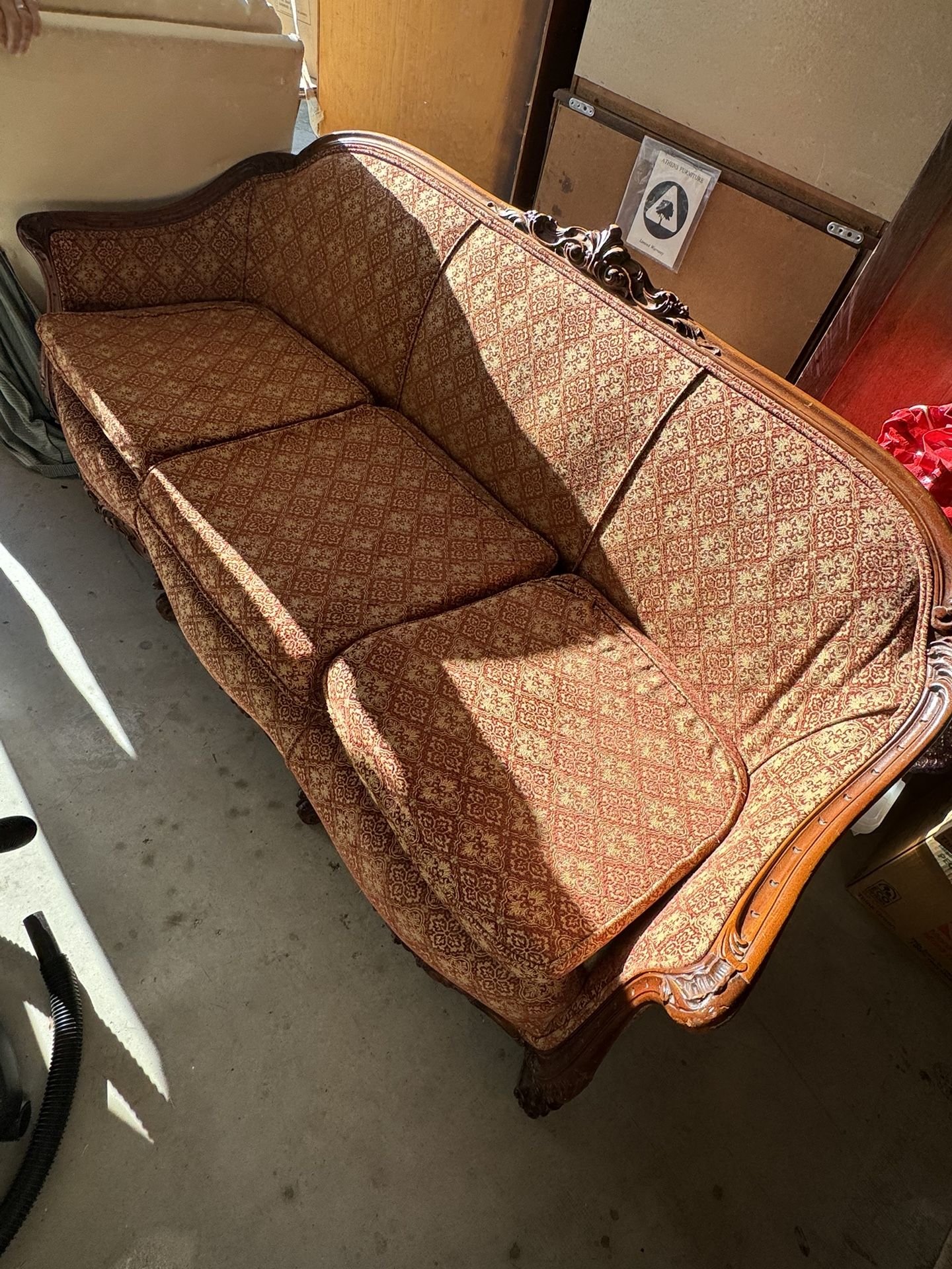 Antique sofa and side chair that were re covered. Wooden carvings on both