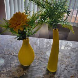 Two yellow glass vases