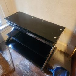 TV Stand Fits 55 Inch TV But Really Depends On Where The Legs On The TV Are