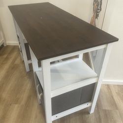 modern white and dark wood computer desk features integrated side storage shelves and two gray fabric storage drawers with rope handles
