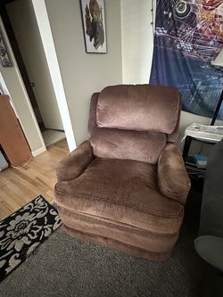 Ashley‘s furniture overstuffed manual rocker recliner.