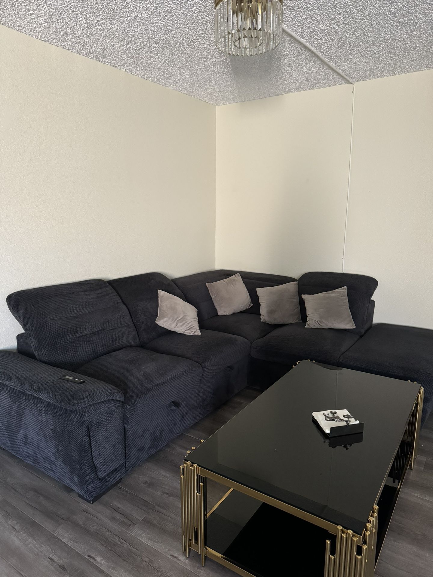 Large dark blue sofa, folding, with a storage box