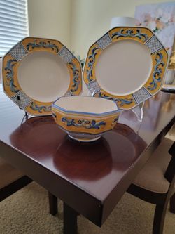 Fitz & Floyd Ricamo Trattoria collection.  Hand painted ceramic.  The colors are blue, yellow,  & white.
