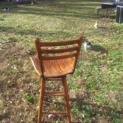 three wooden bar Stools