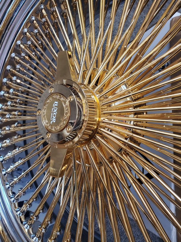4 22INCH GOLD WIRE WHEELS WITH CHROME LIP AND GOLD KNOCK OFF CENTER CAPS WITH ALL HARDWARE $3300