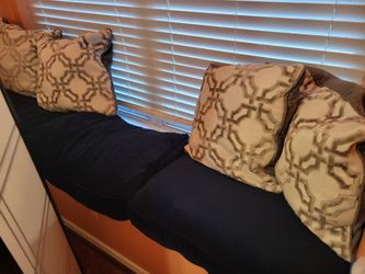 Pillows and cushions used on a window bench