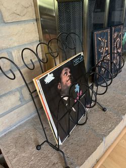 Mid Century Modern black scrolls iron magazine/album rack. 7th st & Tbird