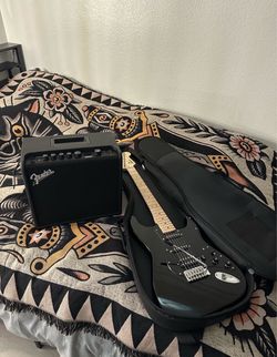 Black Electric Guitar with Fender Amp and Gig Bag