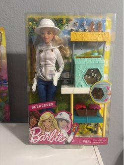 New Barbie Beekeeper Playset features a doll in a career-themed outfit with a beehive station that has spinning bees.