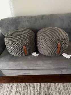 Two gray sofa ottomans