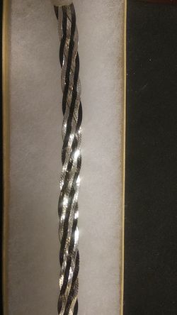 Italian Silver braided bracelet. 71/2 inches long with lobster claw clasp.