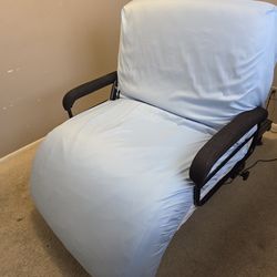 Adjustable twin size bed with safety rails.