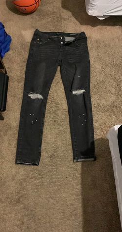 Black ripped paint purple jeans